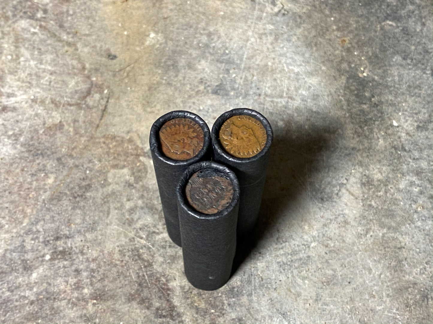 INDIAN HEAD CENT showing on end of old black unsearched us wheat penny roll cent coins estate collection sale lot hoard