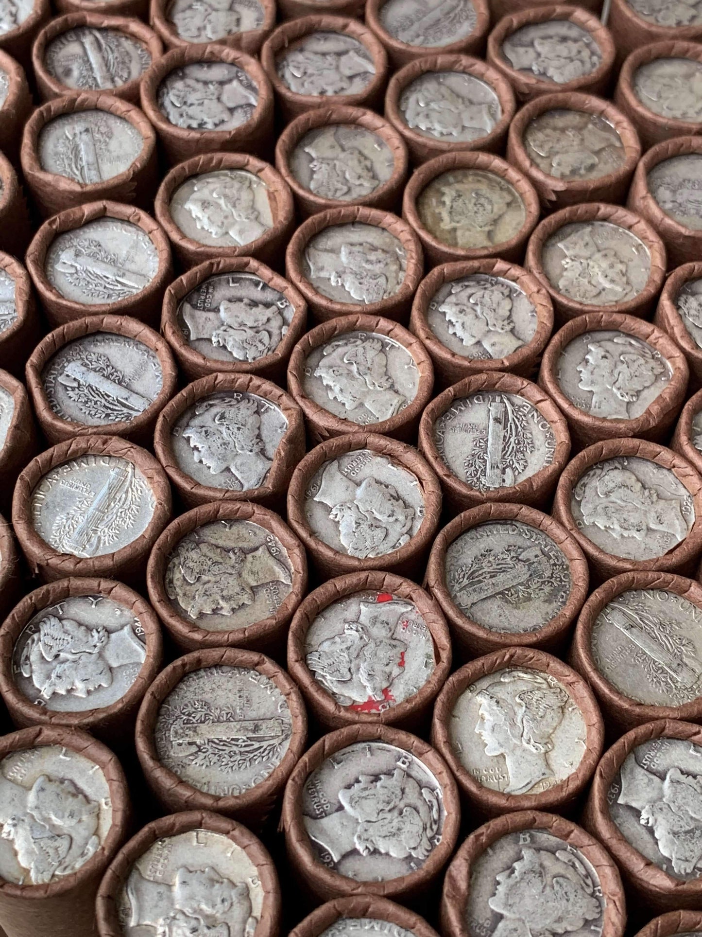 VINTAGE DARK BROWN BANK ROLL WITH A SILVER MERCURY DIME SHOWING