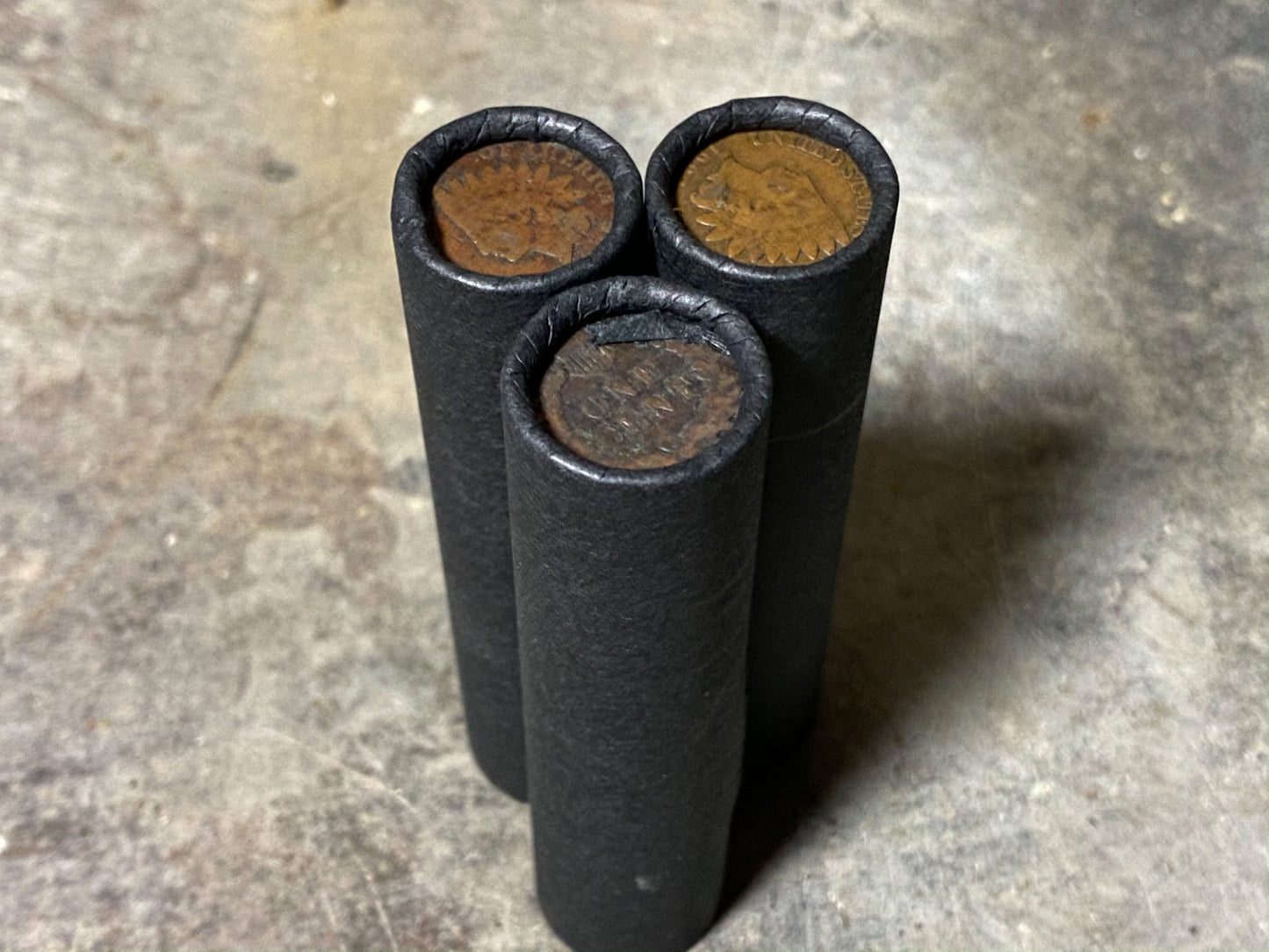 INDIAN HEAD CENT showing on end of old black unsearched us wheat penny roll cent coins estate collection sale lot hoard