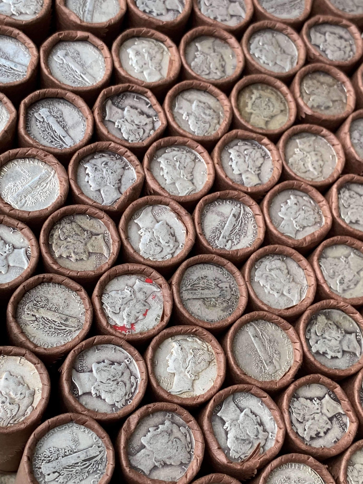 VINTAGE DARK BROWN BANK ROLL WITH A SILVER MERCURY DIME SHOWING