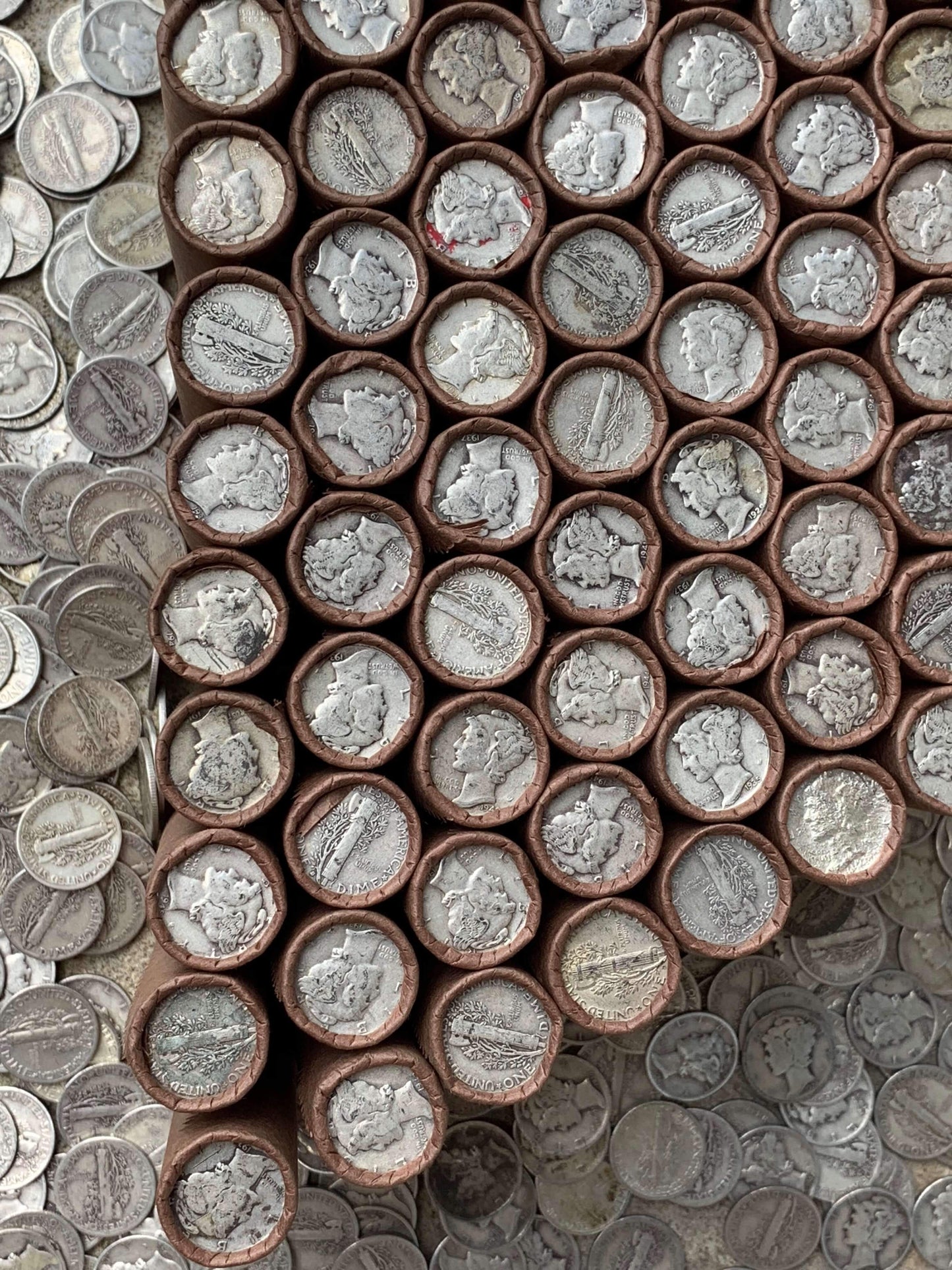 VINTAGE DARK BROWN BANK ROLL WITH A SILVER MERCURY DIME SHOWING