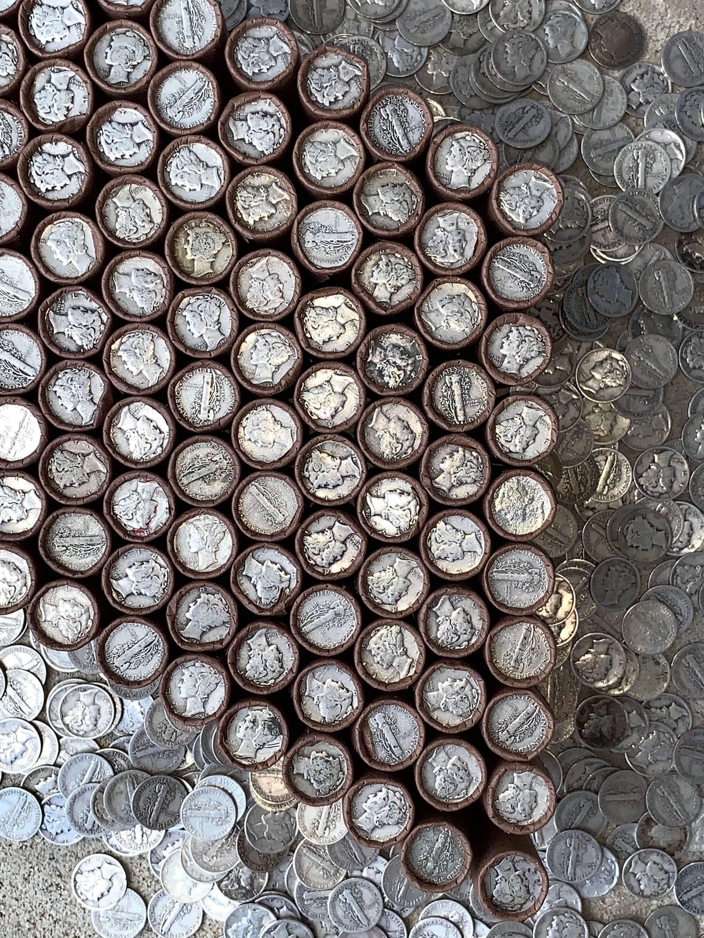 VINTAGE DARK BROWN BANK ROLL WITH A SILVER MERCURY DIME SHOWING