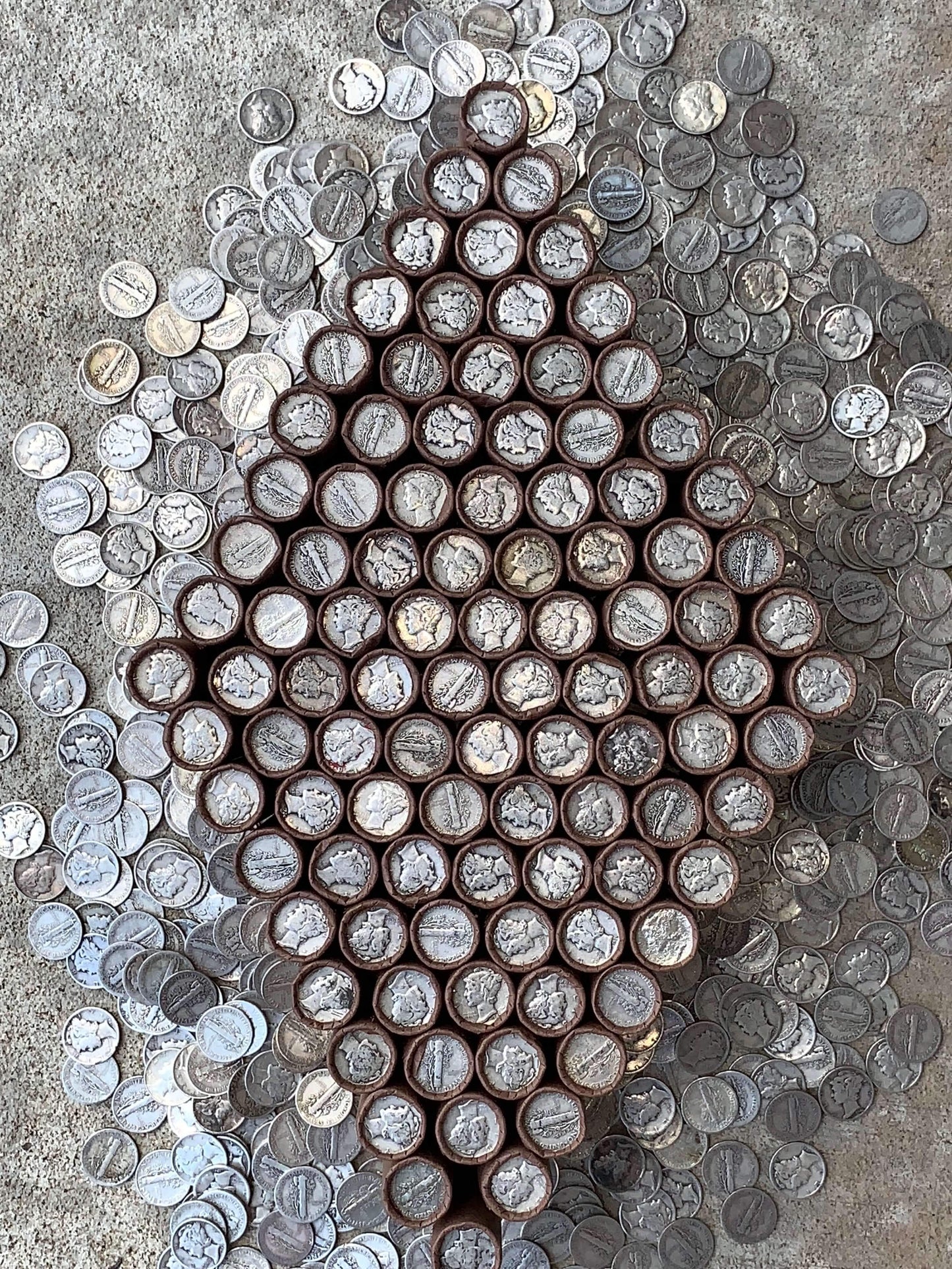 VINTAGE DARK BROWN BANK ROLL WITH A SILVER MERCURY DIME SHOWING