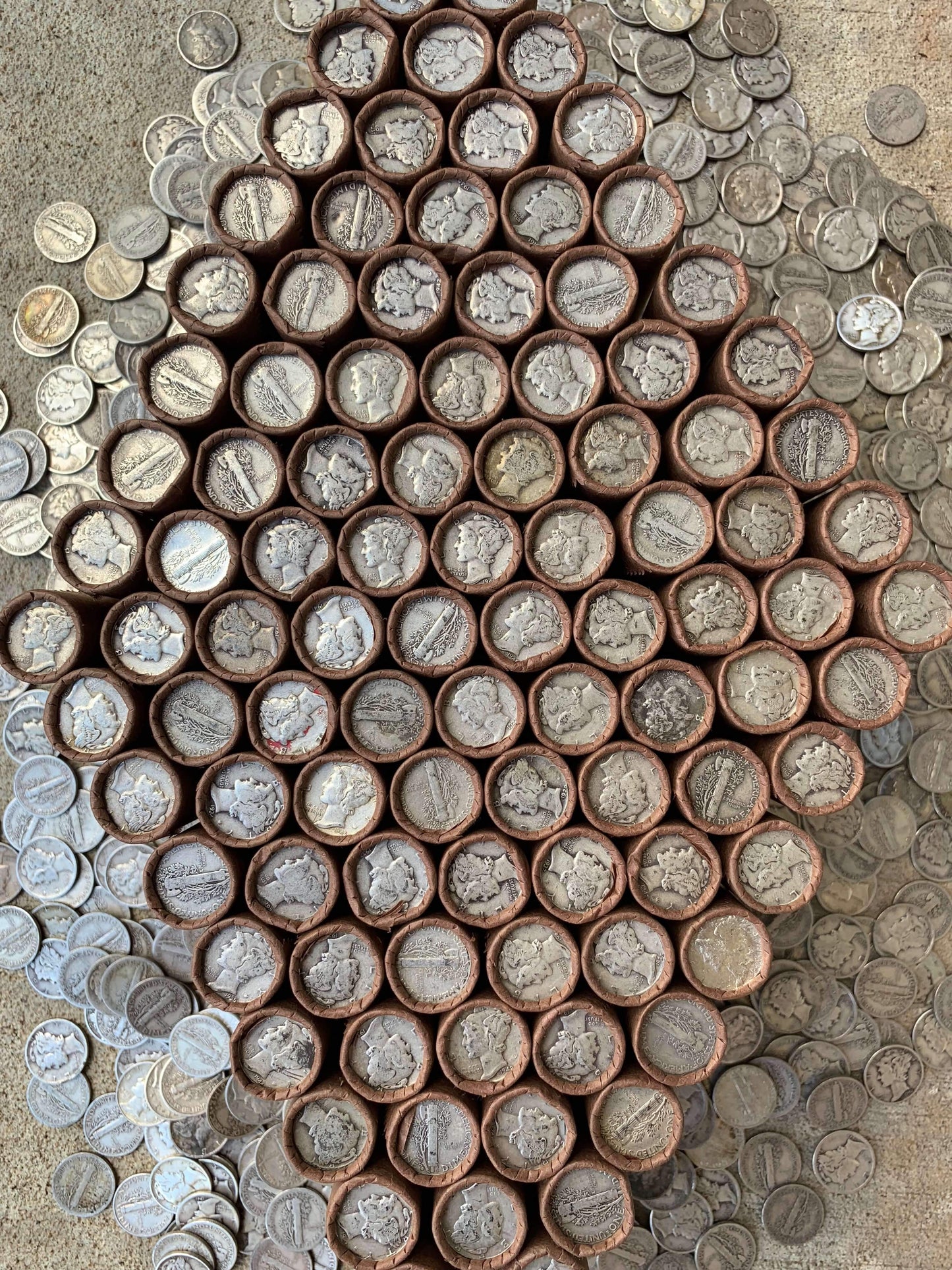 VINTAGE DARK BROWN BANK ROLL WITH A SILVER MERCURY DIME SHOWING