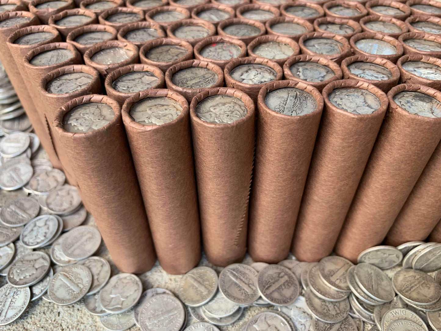 VINTAGE DARK BROWN BANK ROLL WITH A SILVER MERCURY DIME SHOWING