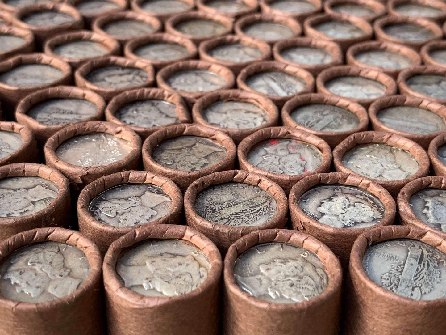 VINTAGE DARK BROWN BANK ROLL WITH A SILVER MERCURY DIME SHOWING