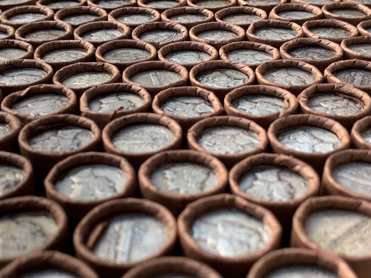 VINTAGE DARK BROWN BANK ROLL WITH A SILVER MERCURY DIME SHOWING