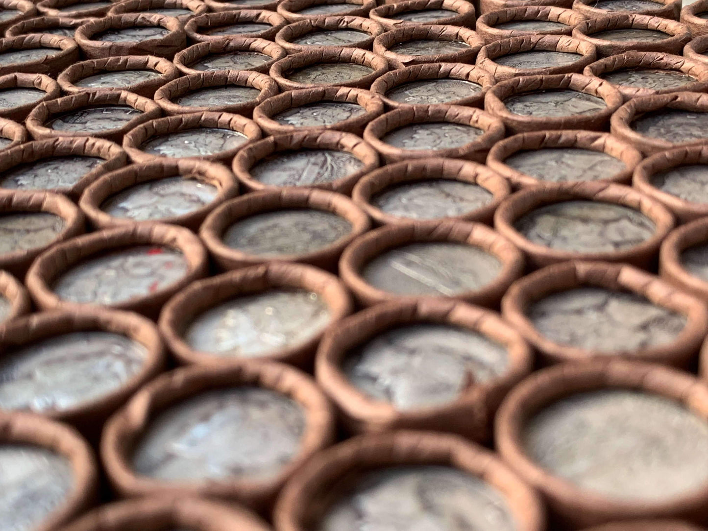 VINTAGE DARK BROWN BANK ROLL WITH A SILVER MERCURY DIME SHOWING