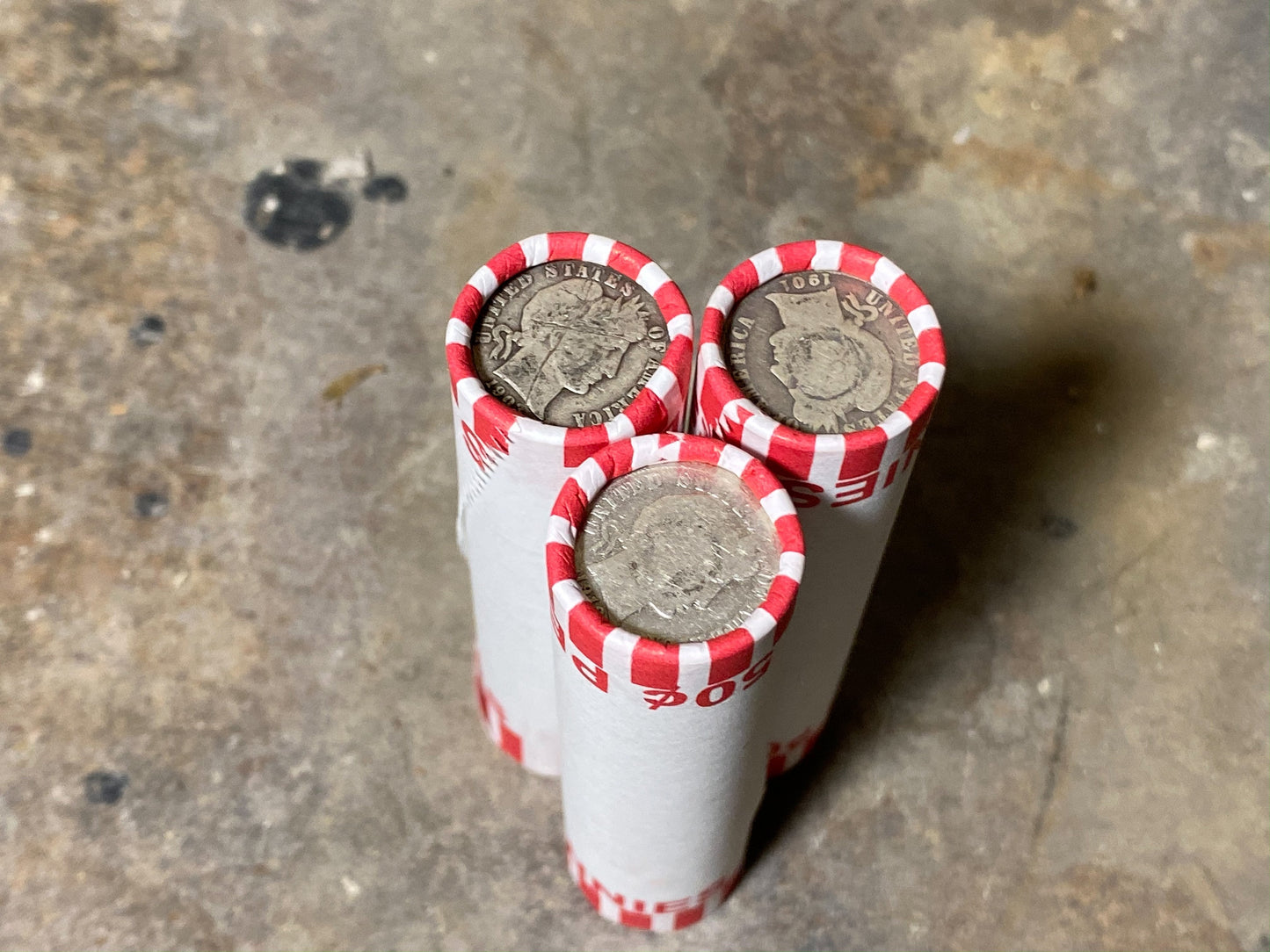 SILVER BARBER DIME showing on end of white old vintage us wheat cent coin penny roll lot estate money sale cents hoard