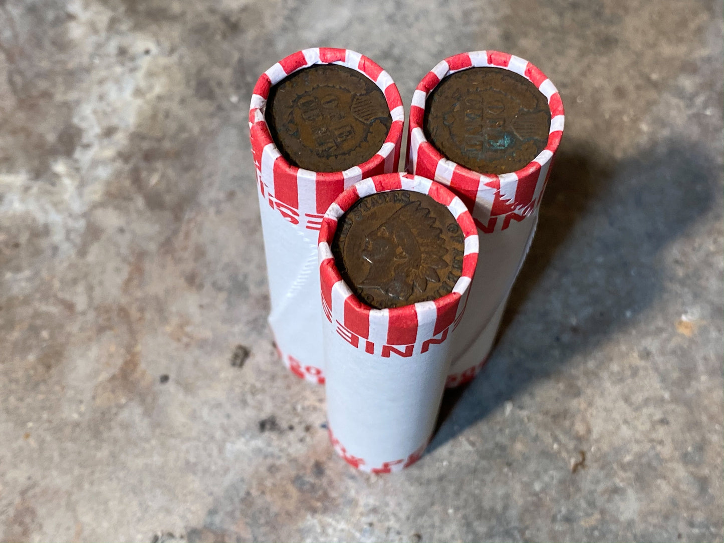 INDIAN HEAD CENT showing on one end of old unsearched white us wheat penny roll coins estate lot hoard collection coin sale money