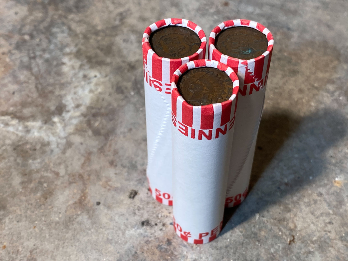 INDIAN HEAD CENT showing on one end of old unsearched white us wheat penny roll coins estate lot hoard collection coin sale money