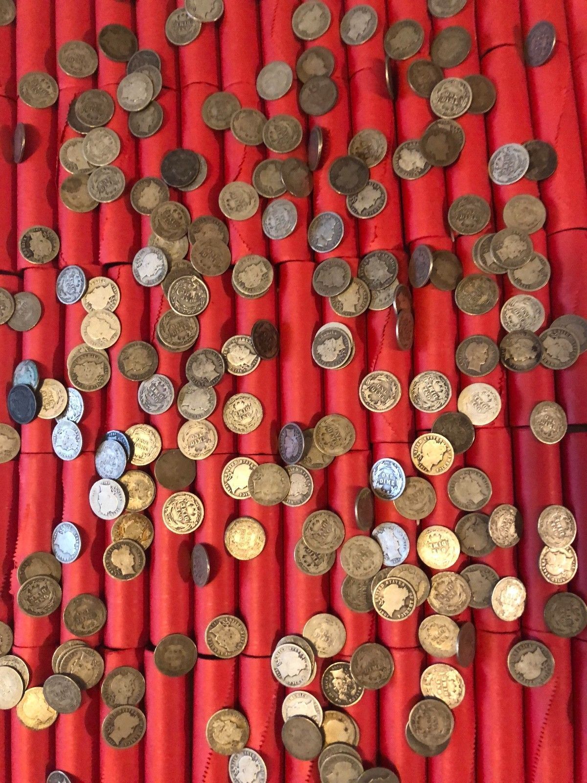 TIGHTLY CRIMPED RED BANK WRAPPED ROLLS OF WHEAT CENTS WITH BARBER DIMES SHOWING