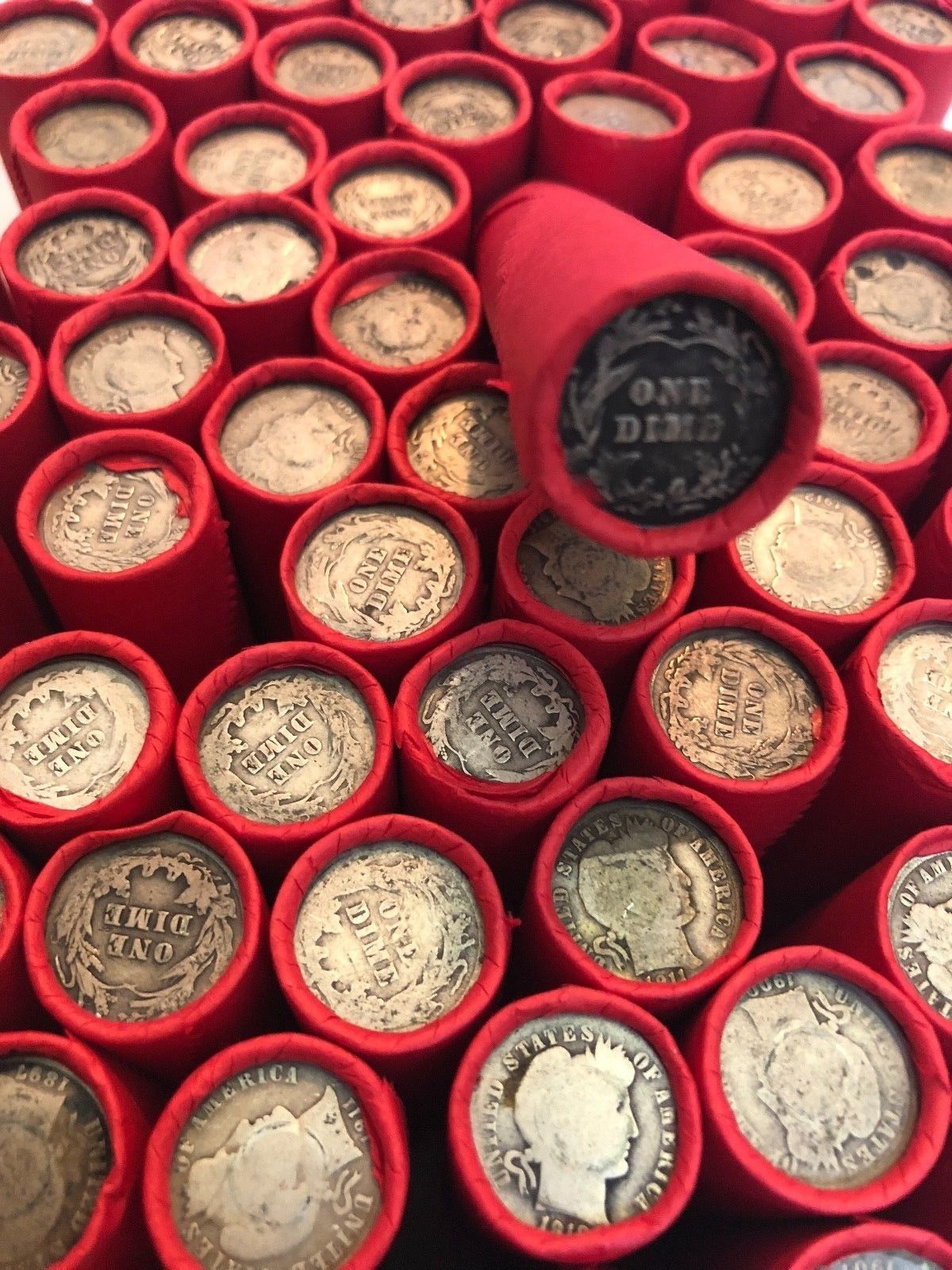 TIGHTLY CRIMPED RED BANK WRAPPED ROLLS OF WHEAT CENTS WITH BARBER DIMES SHOWING