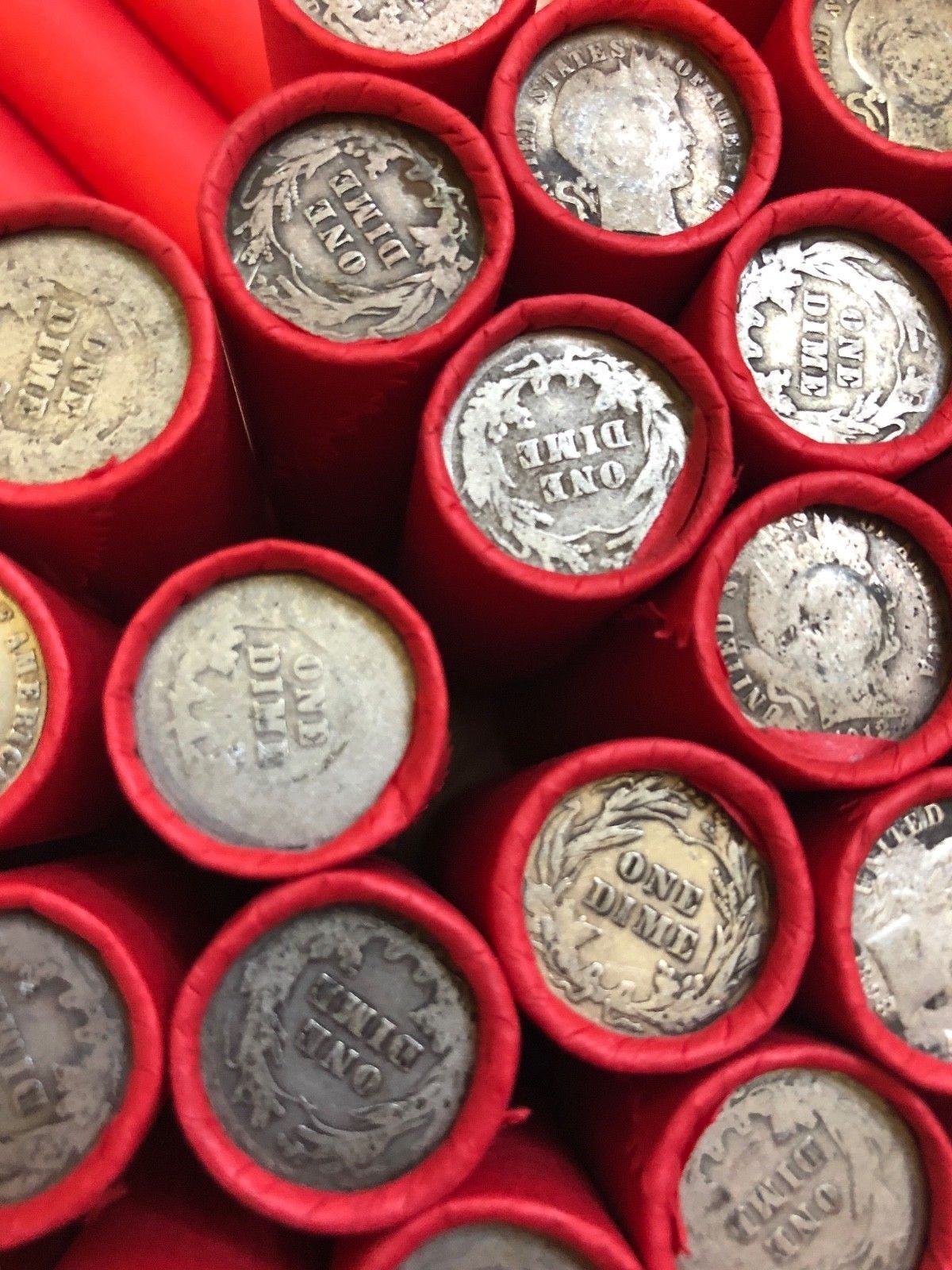 TIGHTLY CRIMPED RED BANK WRAPPED ROLLS OF WHEAT CENTS WITH BARBER DIMES SHOWING