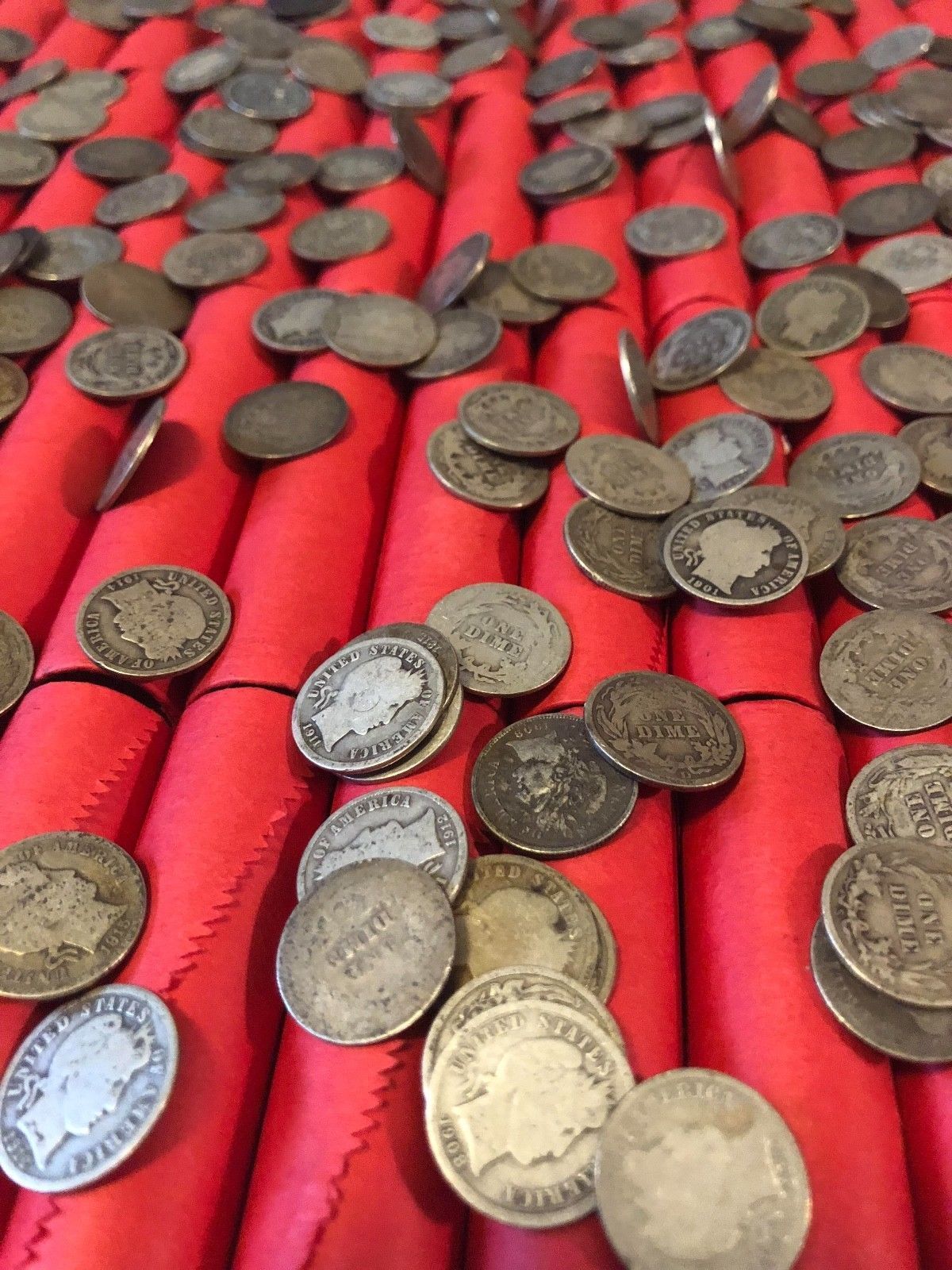 TIGHTLY CRIMPED RED BANK WRAPPED ROLLS OF WHEAT CENTS WITH BARBER DIMES SHOWING